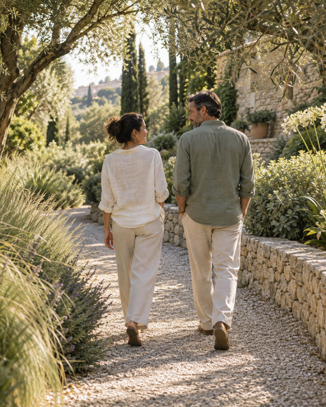 Two people taking a relaxed walk together through a leafy garden
